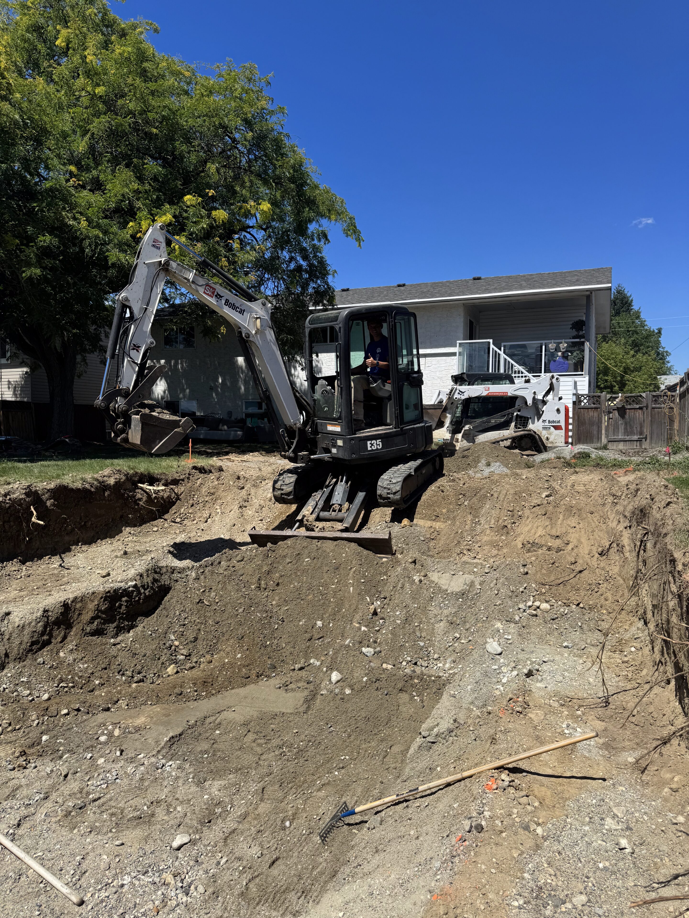 Excavator digging at a construction site.